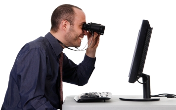 business man looking at a computer monitor