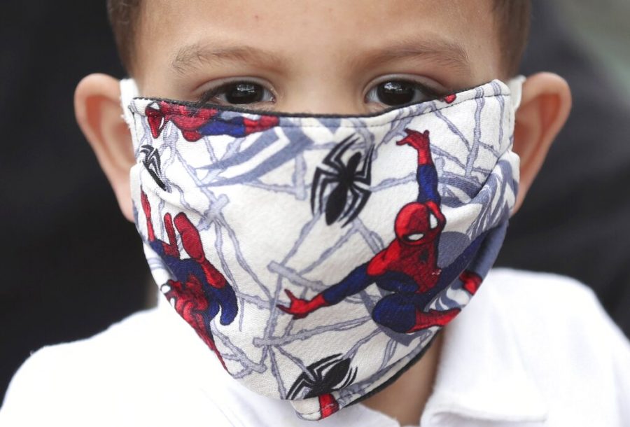 A boy wears a Spiderman face mask amid the spread of the new coronavirus in Bogota, Colombia, Thursday, April 30, 2020. (AP Photo/Fernando Vergara)