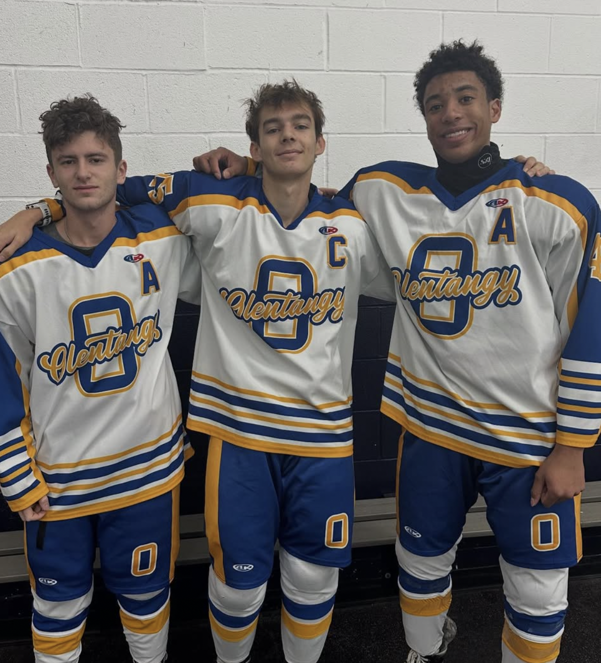 JV hockey plays pose for captains picture. Two of the plays are apart of Chiller's team. 
