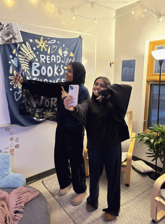 Students take pictures to post on social media. At the start of the school year, students were allowed to use their phones before the new phone policy had taken place.
