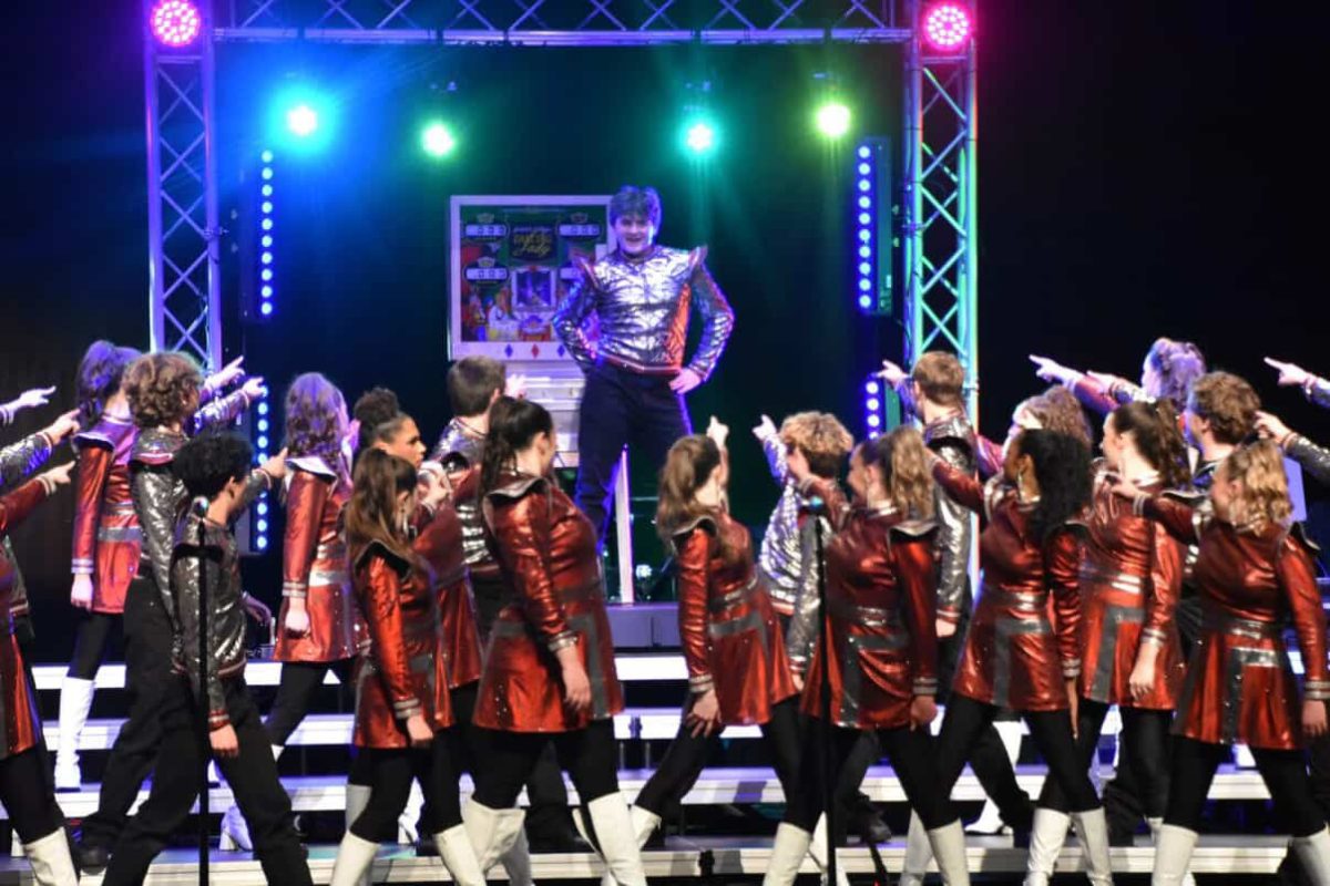The dancers end the show in their final poses. Soloist, Ari Ries stands above them in victory. 
(Permission to print Ari Ries) 